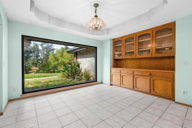 6710 Golden State Blvd, Madera, CA 93637 - unfurnished dining area featuring a chandelier and baseboards