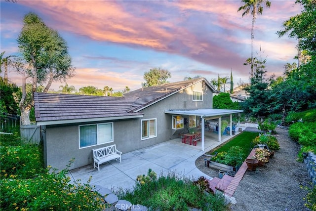 6255 Barranca Dr, Riverside, CA 92506 - rear view of house featuring stucco siding and a patio