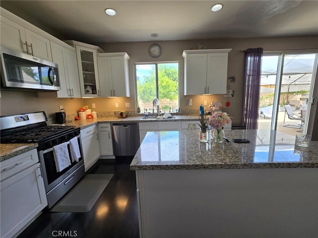 1315 Plaza Way, Perris, CA 92570 - kitchen with stainless steel appliances, plenty of natural light, recessed lighting, and white cabinets