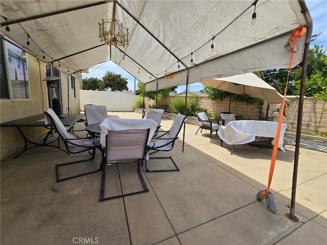 1315 Plaza Way, Perris, CA 92570 - fenced backyard with outdoor dining space and a patio area