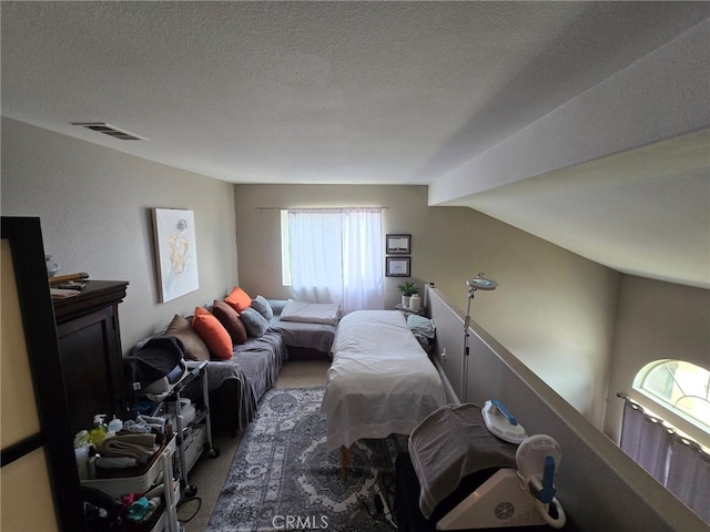1315 Plaza Way, Perris, CA 92570 - carpeted bedroom with lofted ceiling and a textured ceiling