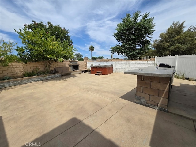 1315 Plaza Way, Perris, CA 92570 - fenced backyard with area for grilling, a hot tub, and a patio area
