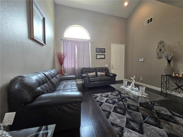 1315 Plaza Way, Perris, CA 92570 - living area with high vaulted ceiling, wood finished floors, and recessed lighting
