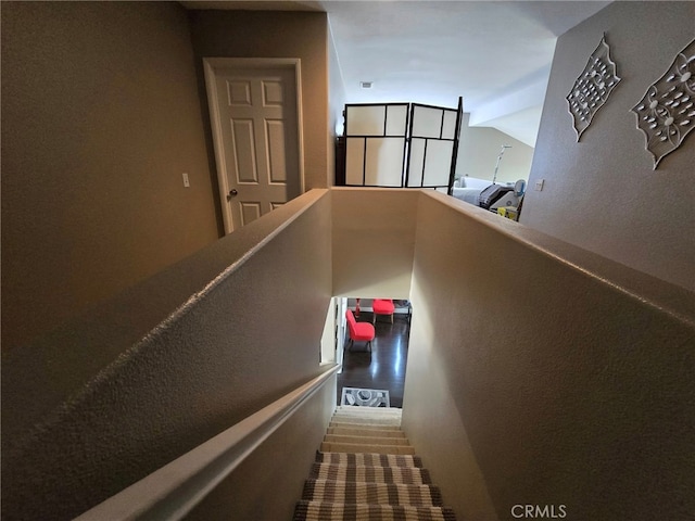 1315 Plaza Way, Perris, CA 92570 - staircase featuring lofted ceiling