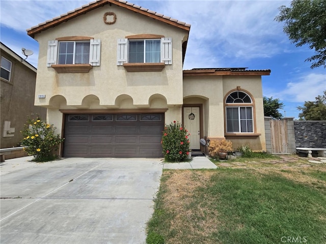 1315 Plaza Way, Perris, CA 92570 - mediterranean / spanish-style home featuring stucco siding, a garage, and driveway