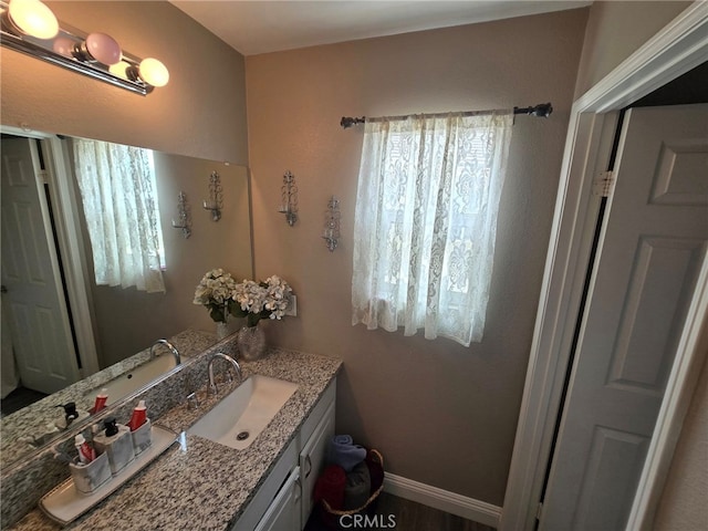 1315 Plaza Way, Perris, CA 92570 - bathroom with vanity and baseboards