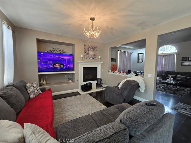 1315 Plaza Way, Perris, CA 92570 - living area with a chandelier and a fireplace with raised hearth