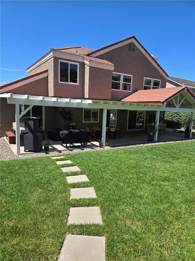 12026 Haven Crest St, Moorpark, CA 93021 - rear view of property with stucco siding, a patio, and a lawn