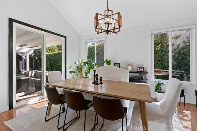 12026 Haven Crest St, Moorpark, CA 93021 - dining space featuring healthy amount of natural light, a chandelier, vaulted ceiling, and light wood finished floors