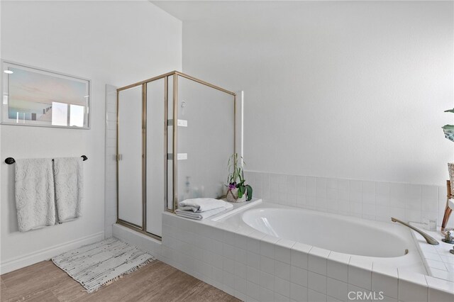 12026 Haven Crest St, Moorpark, CA 93021 - full bathroom with wood finished floors, a stall shower, and a bath