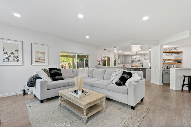 12026 Haven Crest St, Moorpark, CA 93021 - living room featuring light wood-type flooring, recessed lighting, and a chandelier