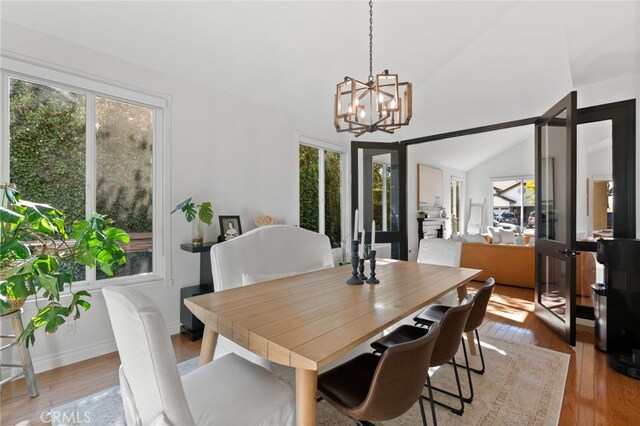 12026 Haven Crest St, Moorpark, CA 93021 - dining space with plenty of natural light, wood-type flooring, a chandelier, and lofted ceiling