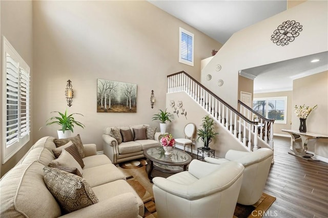 14181 Vai Brothers Dr, Rancho Cucamonga, CA 91739 - living room featuring wood finished floors, a high ceiling, stairs, and crown molding
