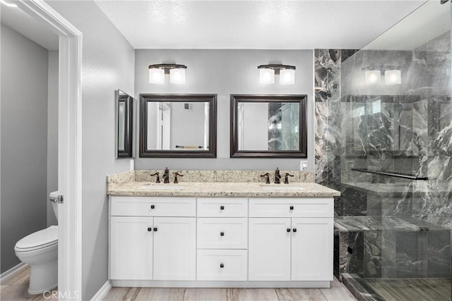 14181 Vai Brothers Dr, Rancho Cucamonga, CA 91739 - bathroom featuring a marble finish shower and double vanity