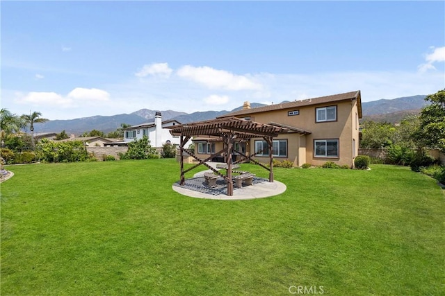 14181 Vai Brothers Dr, Rancho Cucamonga, CA 91739 - back of property with a pergola, a fenced backyard, a patio area, and a mountain view