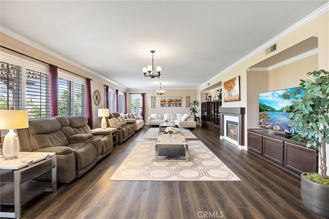 14181 Vai Brothers Dr, Rancho Cucamonga, CA 91739 - living room featuring a chandelier, a glass covered fireplace, dark wood-style flooring, and crown molding