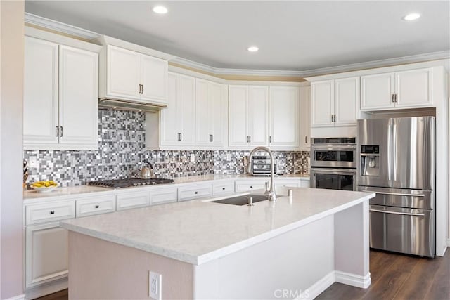 14181 Vai Brothers Dr, Rancho Cucamonga, CA 91739 - kitchen featuring stainless steel appliances, white cabinetry, a center island with sink, decorative backsplash, and dark wood-style flooring