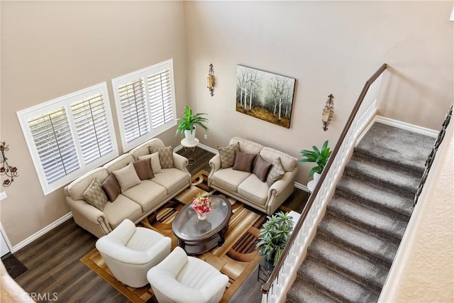 14181 Vai Brothers Dr, Rancho Cucamonga, CA 91739 - living room featuring wood finished floors, stairway, healthy amount of natural light, and a towering ceiling