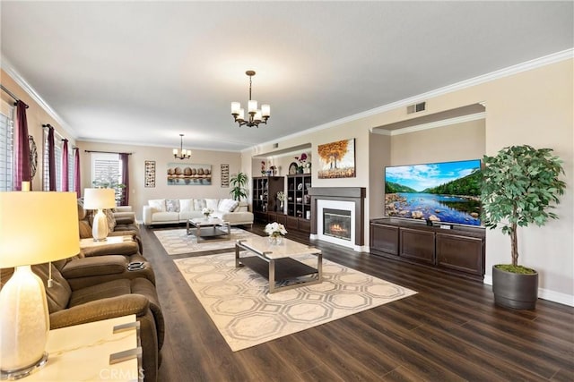 14181 Vai Brothers Dr, Rancho Cucamonga, CA 91739 - living room featuring a chandelier, ornamental molding, dark wood-style flooring, and a glass covered fireplace