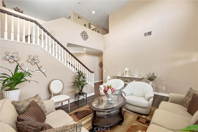 14181 Vai Brothers Dr, Rancho Cucamonga, CA 91739 - living area featuring wood finished floors, stairs, and a towering ceiling