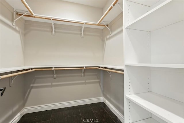 13611 Francisco Dr, Hanford, CA 93230 - walk in closet featuring dark wood finished floors