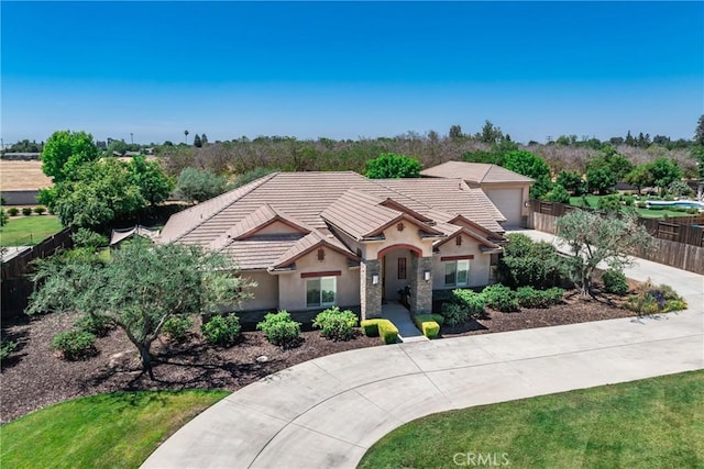 13611 Francisco Dr, Hanford, CA 93230 - view of front of property with a tile roof, driveway, stucco siding, and an attached garage