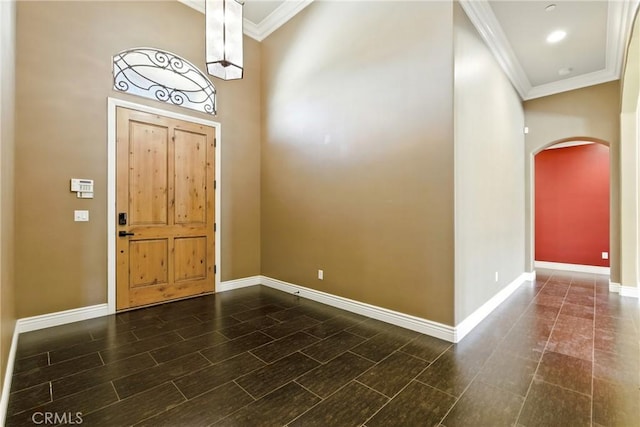 13611 Francisco Dr, Hanford, CA 93230 - foyer entrance featuring arched walkways, crown molding, and a high ceiling