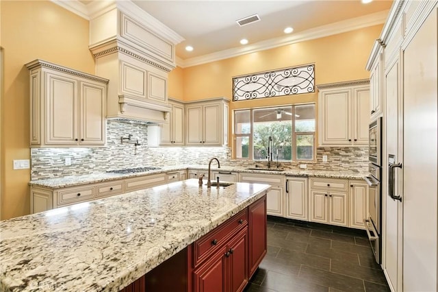 13611 Francisco Dr, Hanford, CA 93230 - kitchen with cream cabinetry, light stone countertops, tasteful backsplash, crown molding, and recessed lighting