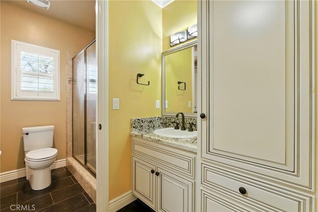 13611 Francisco Dr, Hanford, CA 93230 - bathroom featuring vanity, a shower stall, and wood tiled floors