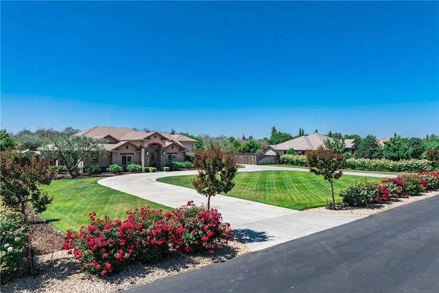 13611 Francisco Dr, Hanford, CA 93230 - view of front of house with a front lawn and curved driveway