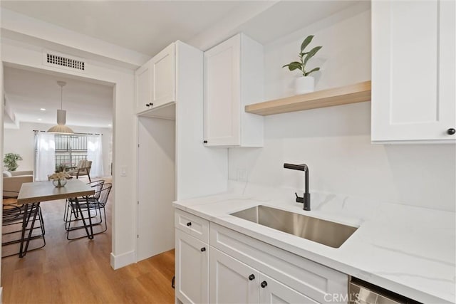 525 E Verdugo Ave Unit E, Burbank, CA 91501 - kitchen featuring light wood-style flooring, white cabinets, light stone counters, open shelves, and recessed lighting