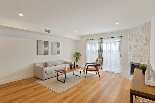 525 E Verdugo Ave Unit E, Burbank, CA 91501 - living area with light wood-style flooring, recessed lighting, and a stone fireplace