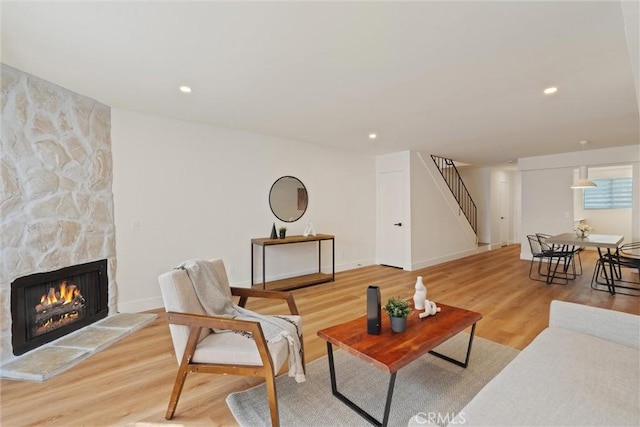 525 E Verdugo Ave Unit E, Burbank, CA 91501 - living area featuring stairs, a stone fireplace, wood finished floors, and recessed lighting