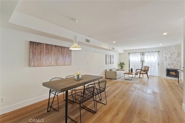 525 E Verdugo Ave Unit E, Burbank, CA 91501 - dining area featuring light wood-style floors, a stone fireplace, and recessed lighting