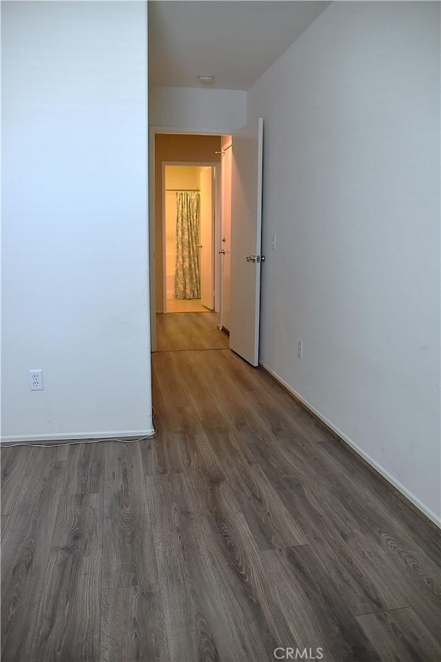 16558 Jasmine St, Victorville, CA 92395 - empty room featuring wood finished floors and baseboards