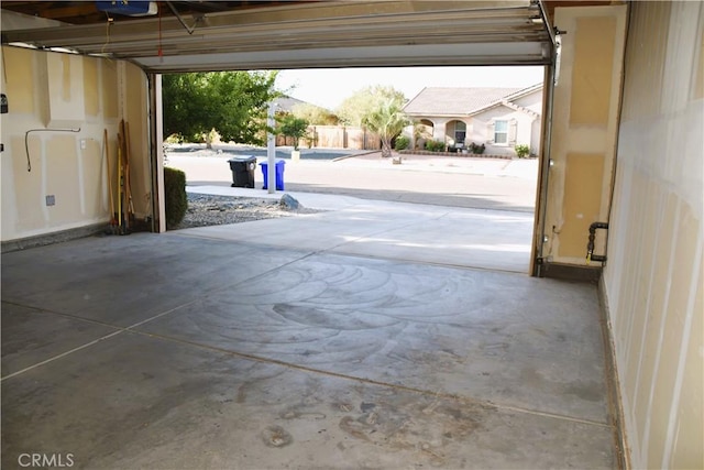 16558 Jasmine St, Victorville, CA 92395 - garage featuring a garage door opener