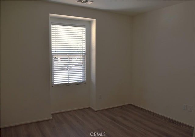 16558 Jasmine St, Victorville, CA 92395 - empty room featuring wood finished floors and baseboards