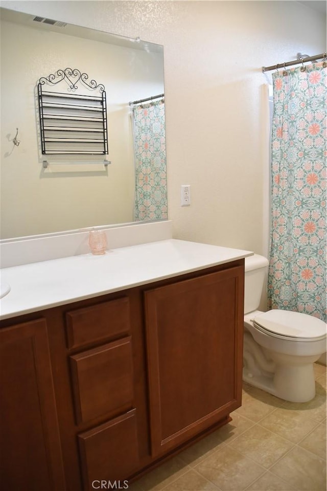 16558 Jasmine St, Victorville, CA 92395 - full bathroom with vanity, a shower with curtain, and tile patterned flooring