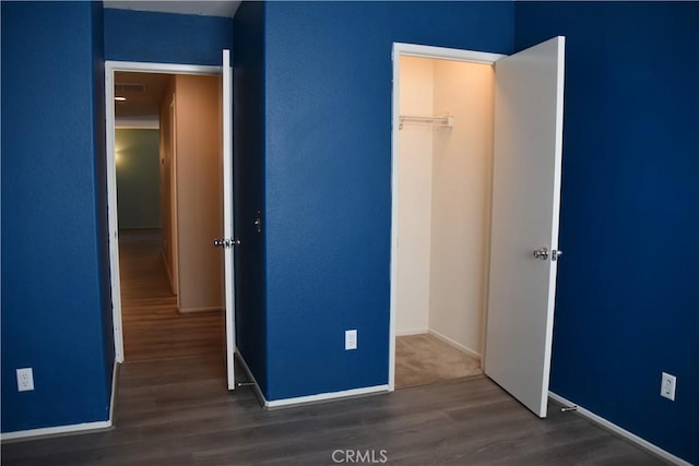 16558 Jasmine St, Victorville, CA 92395 - unfurnished bedroom with wood finished floors and a closet