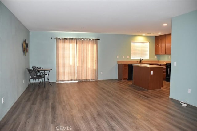 16558 Jasmine St, Victorville, CA 92395 - kitchen featuring a kitchen island, dark wood-style floors, plenty of natural light, stove, and recessed lighting