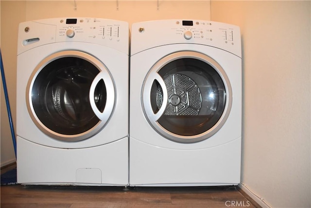 16558 Jasmine St, Victorville, CA 92395 - laundry room featuring washer and dryer and dark wood-style flooring
