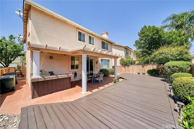11853 Saybrook Dr, Rancho Cucamonga, CA 91730 - deck with an outdoor kitchen, a fenced backyard, and a patio