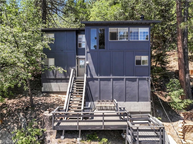 32538 Scandia Dr, Running Springs, CA 92382 - view of front of house featuring a shed, board and batten siding, and stairway