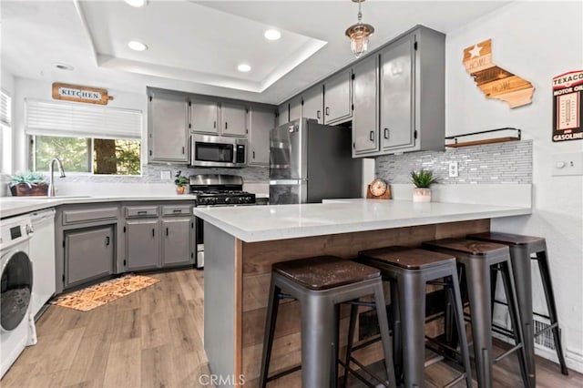 32538 Scandia Dr, Running Springs, CA 92382 - kitchen with appliances with stainless steel finishes, gray cabinets, a peninsula, recessed lighting, and light wood-style floors