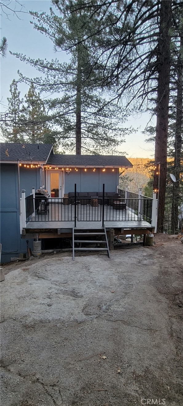 32538 Scandia Dr, Running Springs, CA 92382 - rear view of house featuring a wooden deck and roof with shingles