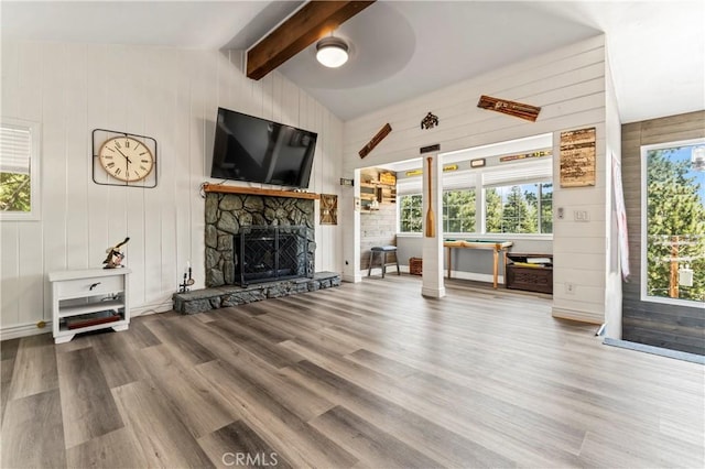 32538 Scandia Dr, Running Springs, CA 92382 - living area with wood finished floors, a stone fireplace, and wood walls