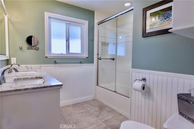 2414 Niagara Way, Costa Mesa, CA 92626 - full bath featuring a wainscoted wall, combined bath / shower with glass door, and double vanity