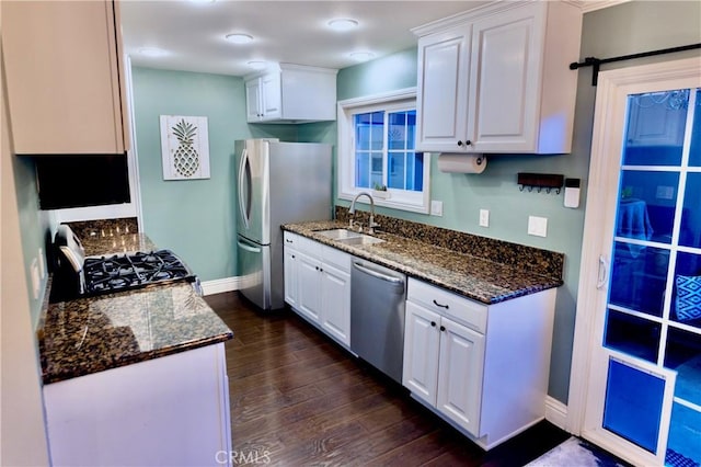 2414 Niagara Way, Costa Mesa, CA 92626 - kitchen featuring appliances with stainless steel finishes, dark wood-style floors, white cabinets, and dark stone countertops