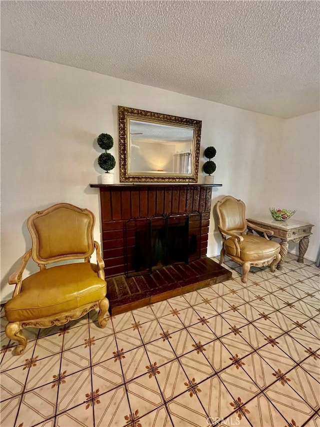 13842 Olive St, Baldwin Park, CA 91706 - sitting room featuring a textured ceiling and a fireplace
