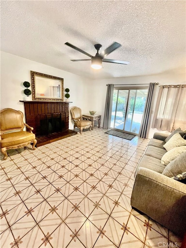 13842 Olive St, Baldwin Park, CA 91706 - living room featuring a ceiling fan, a textured ceiling, and a fireplace